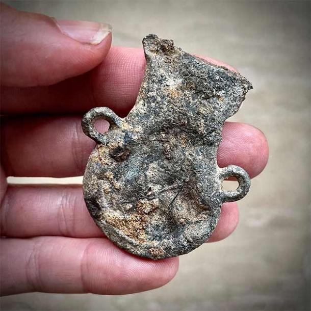 A squashed medieval ampulla found on the medieval castle site by the Dig Ventures team. An ampulla is a little vessel that would have been used by pilgrims for carrying holy water. (Dig Ventures)