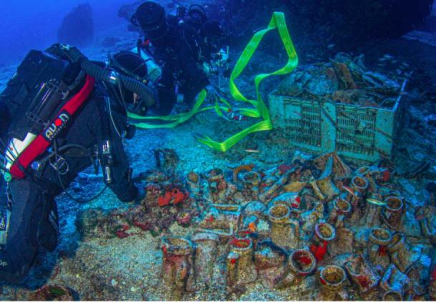Members of the Coast Guard Submarine Disaster Unit Special Dive Team examine and recover many objects at the Antikythera Wreck. (Greek Ministry of Culture)