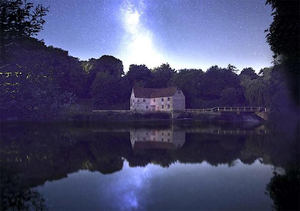The ancient mill at night with stars in the sky. (Oliver Taylor / Adobe stock)