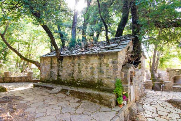 The miracle church of Saint Theodora in Peloponnese, southern Greece. The roof of the church is covered in giant oak trees, seemingly without any roots. (gatsi / Adobe Stock)