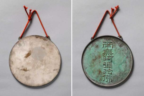     The mirror shown here (back left, front right with six Chinese characters) from the 15th or 16th century must have hung in a temple or noble house.  (Rob Deslongchamps/Cincinnati Museum of Art)