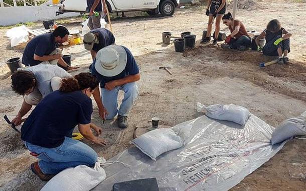Working on the 1,500-year-old mosaic at Ashdod-Yam.
