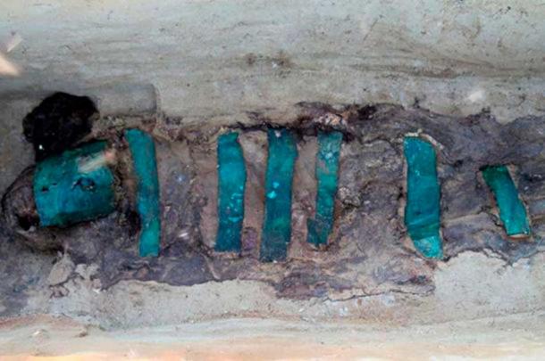 A cocoon with a mummy of an adult was covered with copper plates head to toe. (Alexander Gusev)