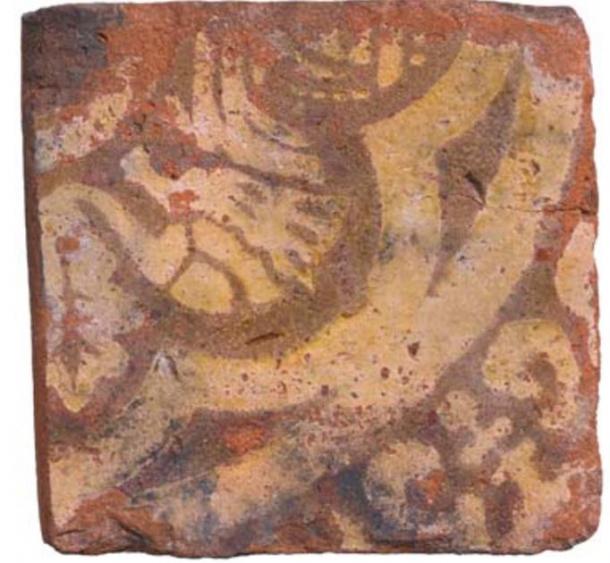 The tile of the mythical beast found at the cesspit site. (MOLA)
