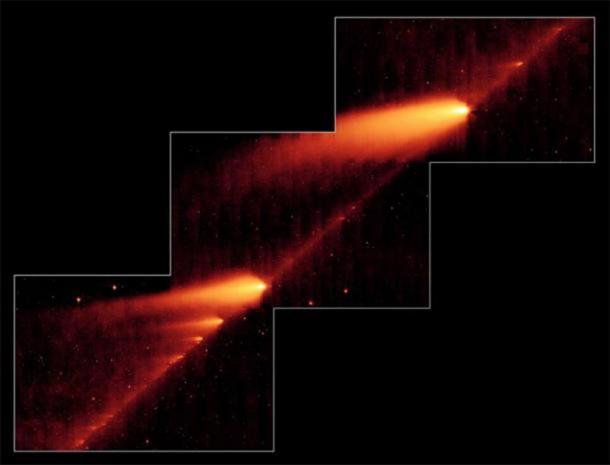 This infrared image from NASA's Spitzer Space Telescope shows the broken Comet 73P/Schwassman-Wachmann 3 skimming along a trail of debris left during its multiple trips around the sun. The flame-like objects are the comet's fragments and their tails, while the dusty comet trail is the line bridging the fragments. (Public Domain )