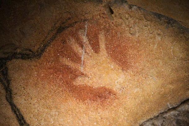 Negative hand print discovered within the Chauvet Cave. (Claude Valette / CC BY-SA 4.0)