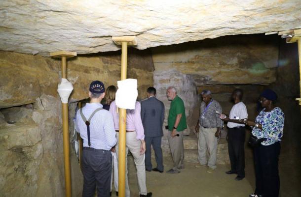 Researchers and media gather in the newly-discovered mummy workshop