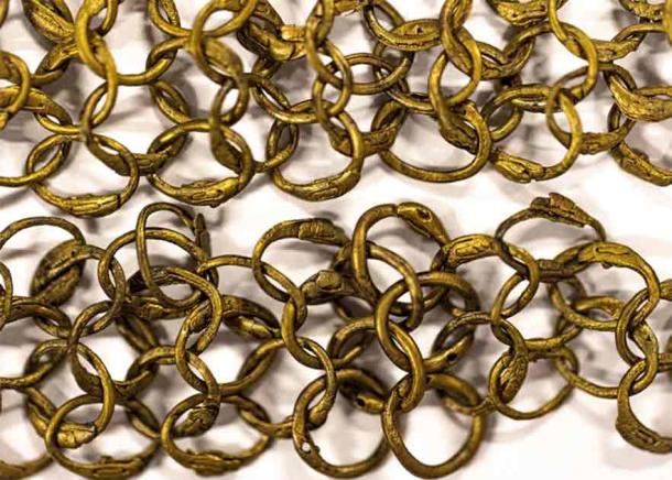 Ornamental border with riveted brass rings for a chainmail shirt (so-called hauberk) which was analyzed in connection with the dives. A chainmail of this quality can consist of up to 150,000 rings. (Rolf Warming/Stockholm University)
