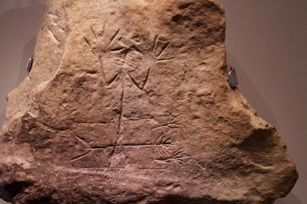 “Unearthed in the main room of the palace of Arad. It depicts two almost identical images of a man with a branch- or sheaf shaped head, one lying down and the other standing. It may represent the fertility god Tammuz or a similar deity, who died in summer and was resurrected in spring, Museum of Israel.”