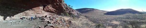 The archaeological site at a rock shelter in South Africa's Kalahari Desert. More than 100,000 years ago, people used the so-called Ga-Mohana Hill North Rockshelter for spiritual activities. (Credit: Jayne Wilkins)