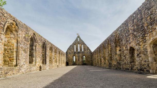 Photo of the inside of Battle Abbey in Battle, Sussex, UK, where the ancient relic list that included Santa’s bone was found. Source: HildaWeges / Adobe Stock