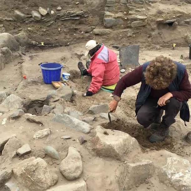 Recording and photographing the stone features underneath the coastal remains of St Patrick’s Chapel (Pembrokeshire), which is an ongoing project related to the history of medieval Wales. (Dyfed Archaeological Trust)