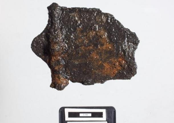 Archaeologists found pieces of a sword sheath in the lake.