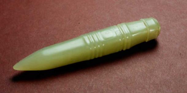 A polished jade stylus dating back to the ancient Liangzhu culture, China (c. 3300 – 2200 BC). The square shaped pin tapering to a point is carved in low relief on all four facets with lozenge-shaped eyes bounded by grooves and ridges. The top of the pin with a raised ridged band surmounted by a boss with bevelled edges. (CC by SA 4.0 / Trustees of the British Museum)