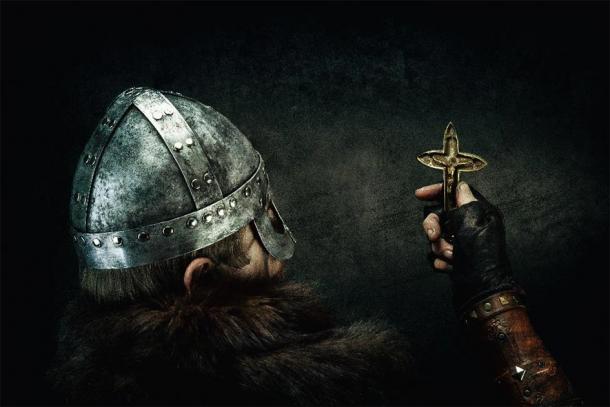 Portrait of a Viking holding a Christian cross in his hand. (Warpedgalerie /Adobe Stock)