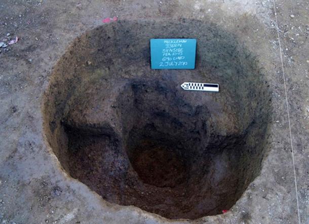 A post pit at the Heckelman site, showing a large post mold at the base of the basin.