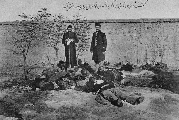 An Iranian postcard showing the Iranian consul M. S. Vezare-Maragai standing in front of a few of Baku’s many Muslim victims from the March Days of 1918. (Public domain)