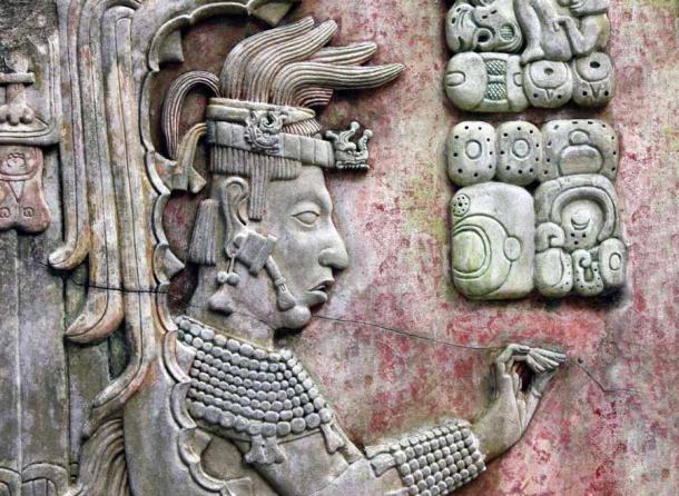 The recently discovered young corn god head was one of many heads that adorned the facades and ceremonial rooms at Palenque. This is a bas-relief carving of a Maya king at Palenque. (frenta / Adobe Stock)