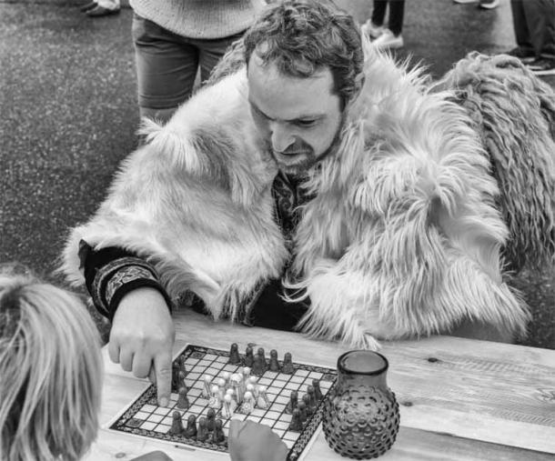 A Viking reenactor playing Hnefatafl (F4Niko / CC BY SA 2.0)