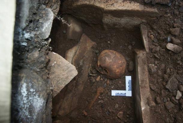 The remains of a woman in her 60s, who died around the 13th century, were found recently under an old church in Wales.