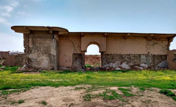 The remains of the reconstructed entrance to the Palace of Ashurnasirpal II. In 2015, ISIS detonated explosives in this building. To protect original fragments, they are now covered in geotextile. (Penn Museum)