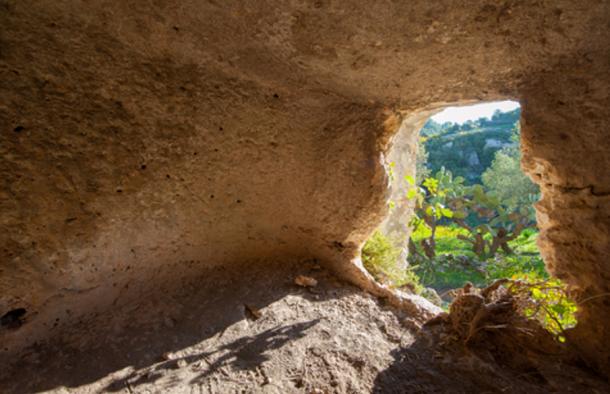 Inside one of the rock-cut tombs of Pantalica