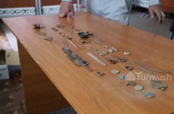 The Kyrgyzstan saber was discovered amongst a treasure trove which included a smelting vessel, coins, a dagger amongst other ancient artifacts. (Siyatbek Ibraliev / Turmush)