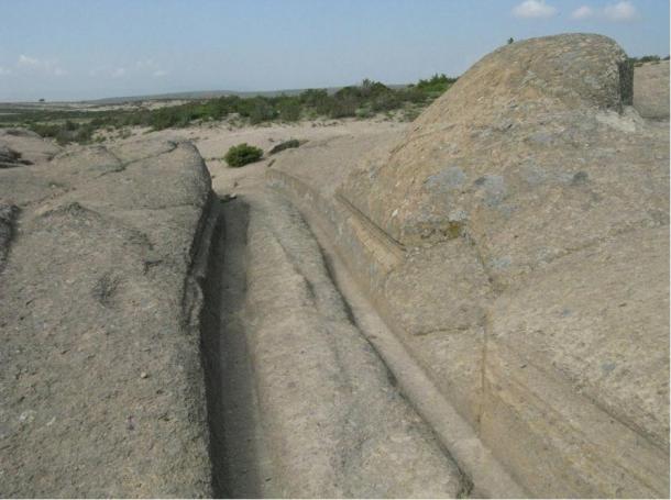 Photograph showing the scratch marks along the side of the tracks. Were these caused by ancient axels?