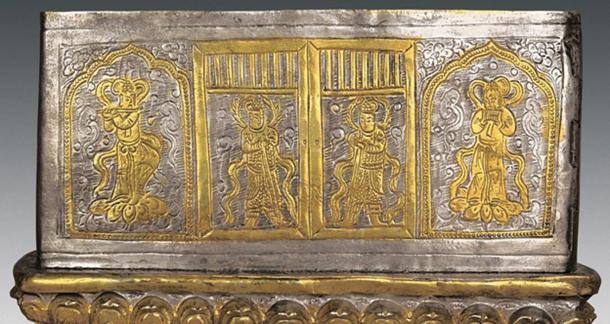 The silver coffin found inside the stupa is decorated with images of gods guarding it with swords. There are also images of spirits called asparas, who are shown playing musical instruments.