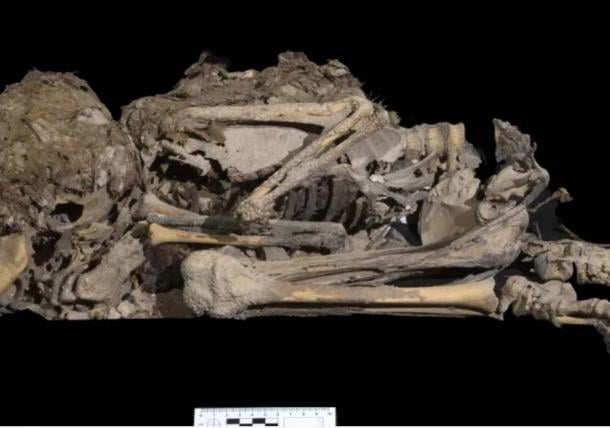 6,000-year-old skeleton of a girl or a boy who was buried wrapped in cloth in one of the many Nahal Hever caves. (Emil Aladjem / Israel Antiquities Authority)