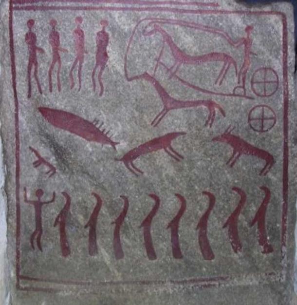 One of the slabs of stone shows a horse drawn chariot with two four-spoked wheels. 