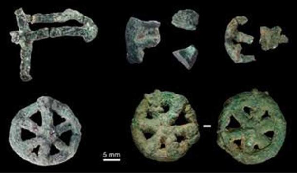 A collection of small lost-wax cast ornamental objects found during excavations at the MR2 site at Mehrgarh.