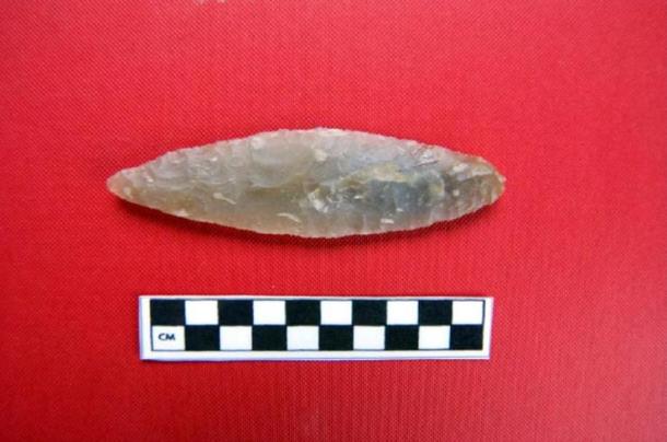 Items found in the tomb include this flint javelin head, plus arrowheads and fragments of New Stone Age pottery