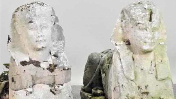 The pair of sphinx statues have seen better days. (Mander Auctioneers)