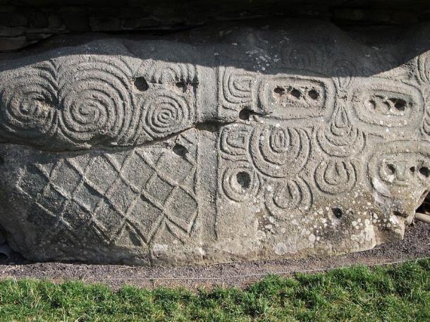 The triple spiral carvings on a wall at Newgrange