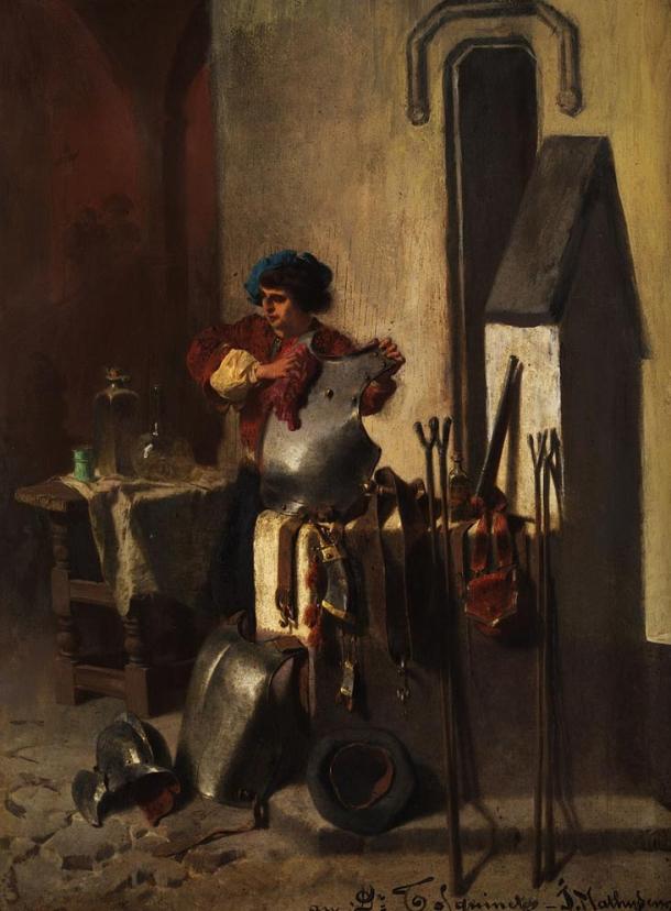 A squire cleaning armor, training for knighthood