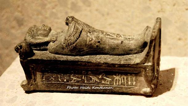 This schist statuette of Crown Prince Thutmose, brother of Akhenaten, depicts him on a bier with a Ba bird on his chest. He is shown as a high priest of Ptah at Memphis and wears a wig and sports a sidelock. The inscription reads: “The King’s Son, Sem Priest, Djhutmose”. Neues Museum, Berlin. (Heidi Kontkanen)