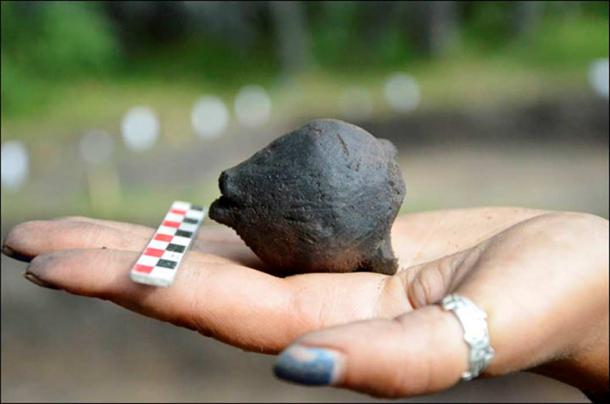 There are little stones inside. We don't know what kind of stones these are, but we will be doing an X-ray to find out. The rattle is still working.' Picture: Lyudmila Mylnikova / Institute of Archaeology and Etnography SB RAS.