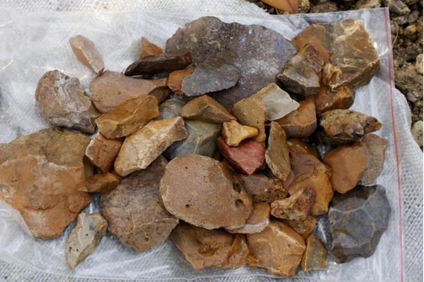 These stone tools, discovered near the site where the very ancient tools were found, could not be dated because they were on the surface of the earth.