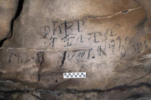 Cherokee syllabary inscription from 1828 relating to a stickball ceremony found in Alabama. (Alan Cressler / The Conversation)