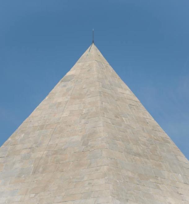 The tip of the Pyramid of Cestius, now back to its shiny white surface