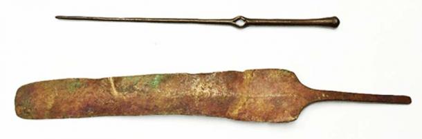 A toggle pin and head of a knife that are 3,500 years old. 