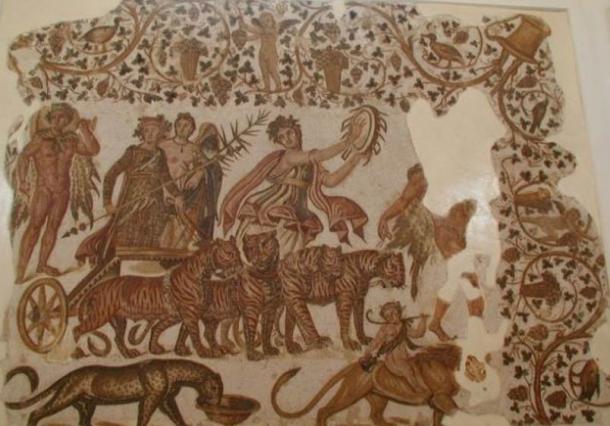 The triumph of Dionysus, with a maenad playing a tympanum, on a Roman mosaic from Tunisia (3rd century AD).