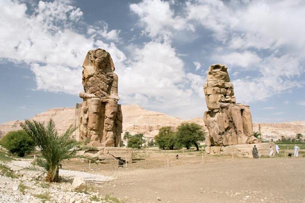 Two statues of Amenhotep III (Memnon's pillars) at the entrance to his temple (CC by SA 2.5)