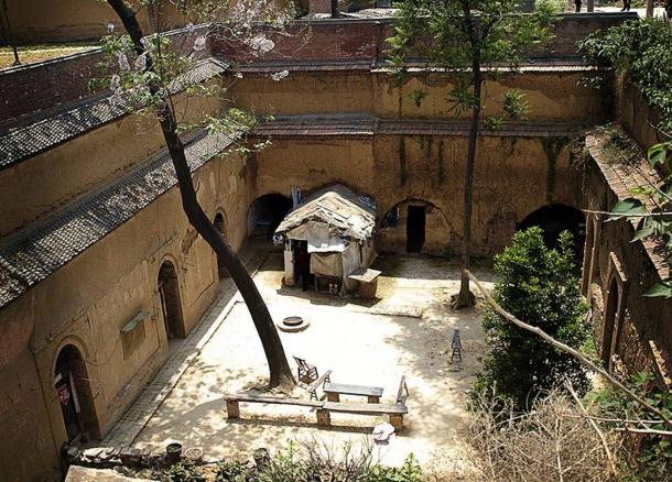 A typical sunken courtyard complex, or pit dwelling in Shaanxi or Henan. The inhabitants live in the caves due to their practicality. 