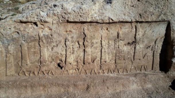The unearthed Assyrian relief carvings showing a procession of the seven main Assyrian gods and goddesses, standing or seated on mythical animals, and the Assyrian king Sargon II. (Alberto Savioli / Land of Nineveh Archaeological Project / University of Udine)