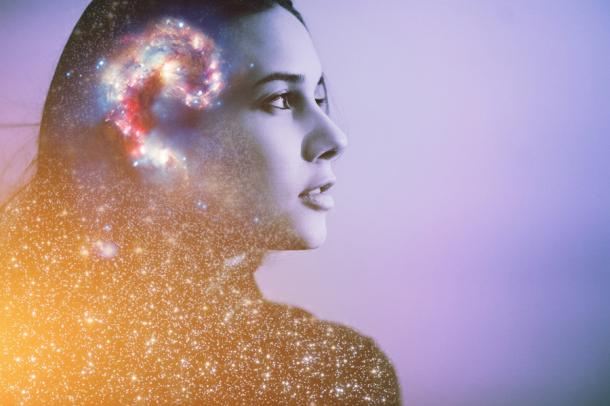 So what is it that makes humans unique?  The answer is neural development and brain function.  The brain of this modern woman is "wired" differently from the brains of our prehistoric ancestors.  (reasoning / Adobe Stock)