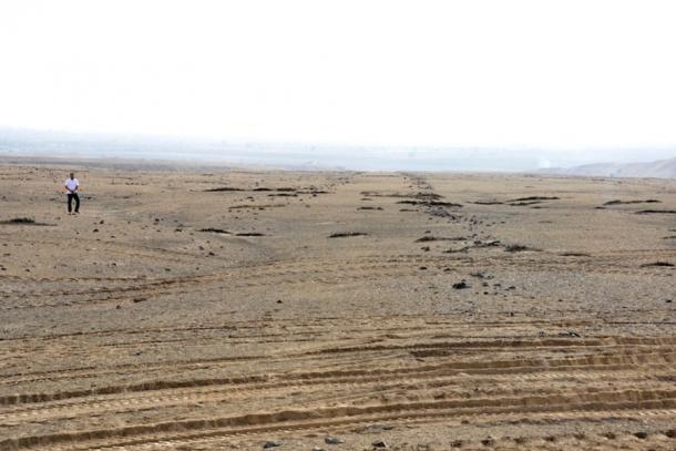 A view of two rock lines that mark the June solstice with a person for scale. (Charles Stanish / Live Science)