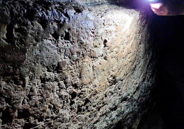 A wall inside the Siloam tunnel is inscribed but yet to be fully deciphered. (Eli Shukrun/The Jerusalem Post)