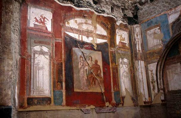 A wall panel of ancient Roman frescos in the College Of the Augustales, center of the cult of the Emperor Augustus, Herculaneum, Naples, Italy. Source (TyB/CC BY 2.0).
